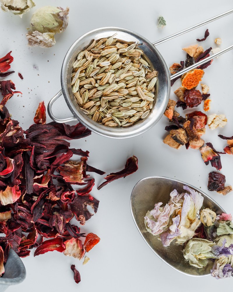 Decoratively arranged herbs and dried flowers.